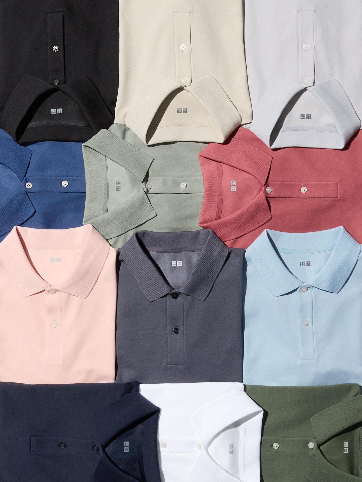 базові поло Uniqlo різних кольорів, розкладені на поверхні - універсальні моделі для щоденного стилю