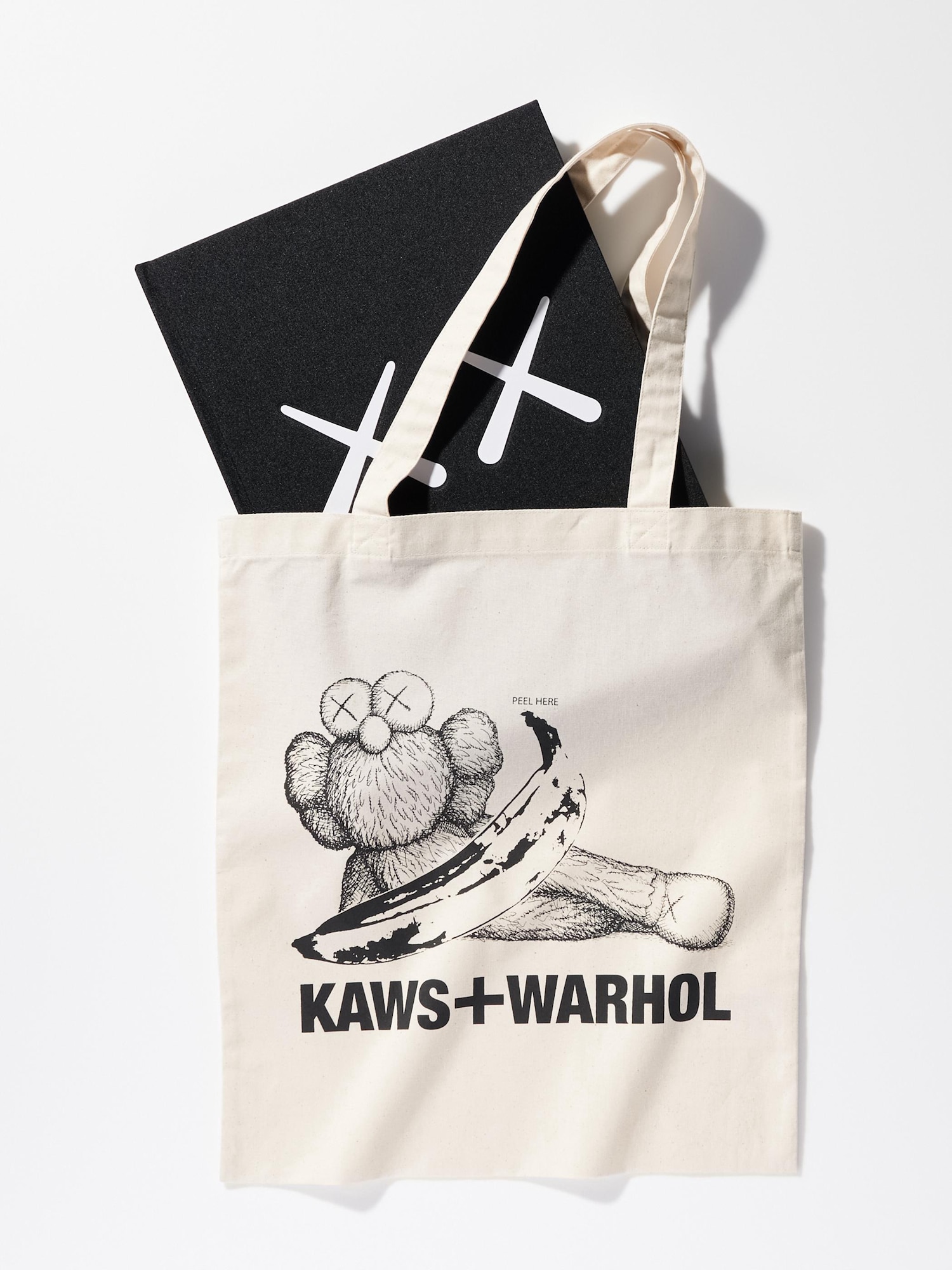 KAWS x Uniqlo tote bag with original outlet paper bag