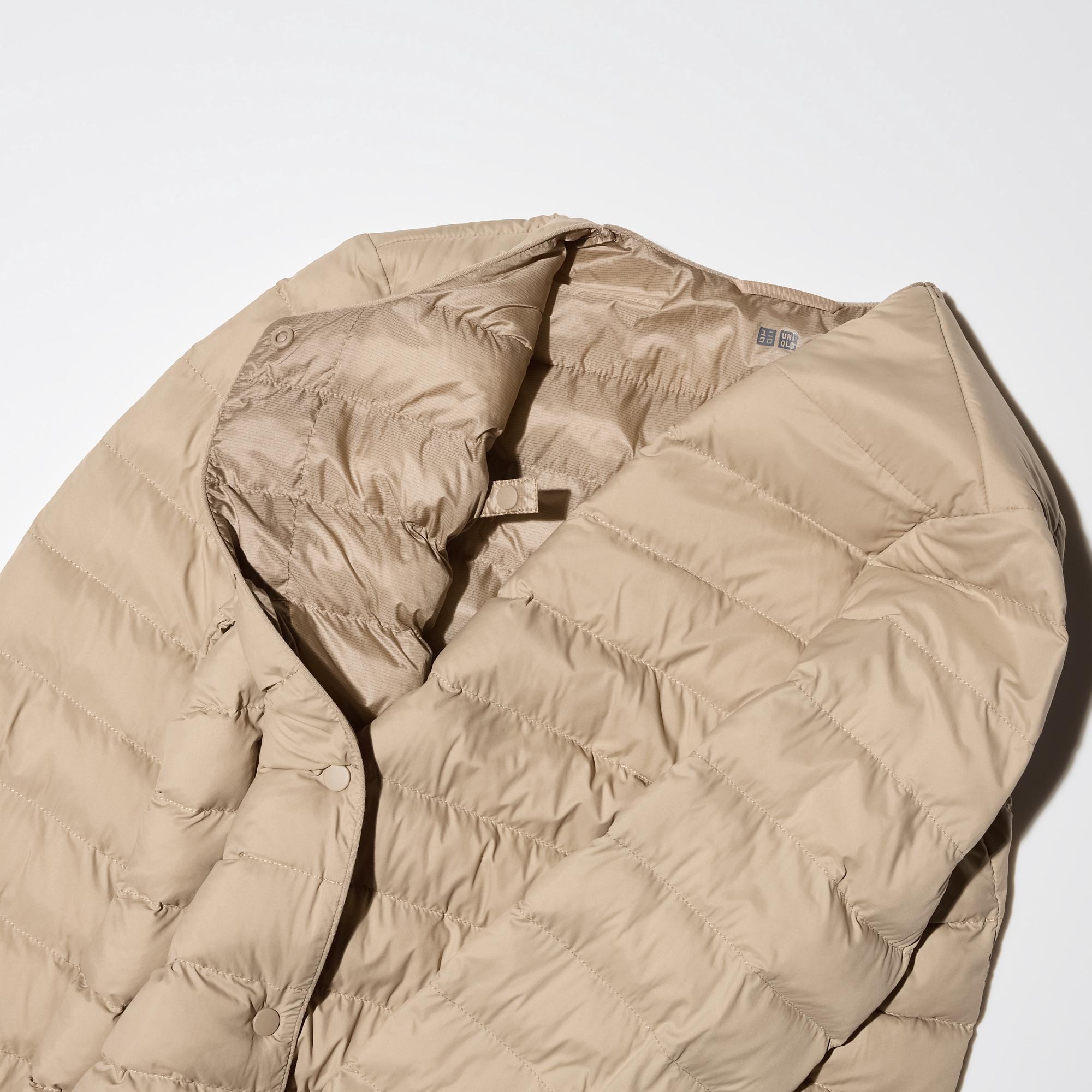 Collar fastens with snap buttons.