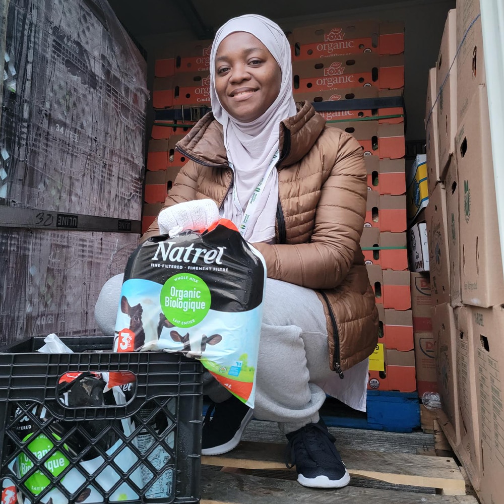 Woman holding bags of milk