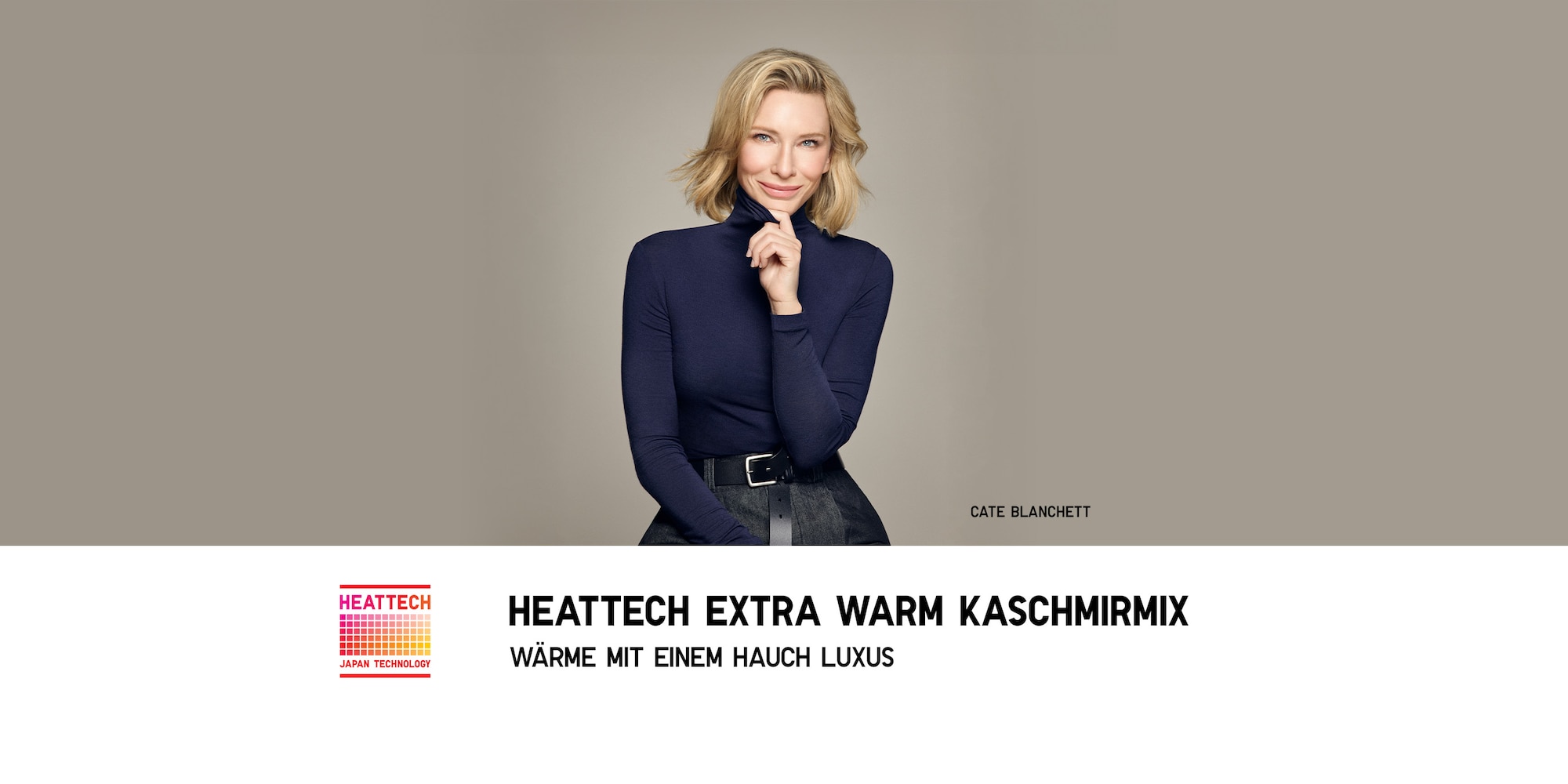 Cate Blanchett trägt ein dunkelblaues Thermoshirt und dunkelblaue Jeans.