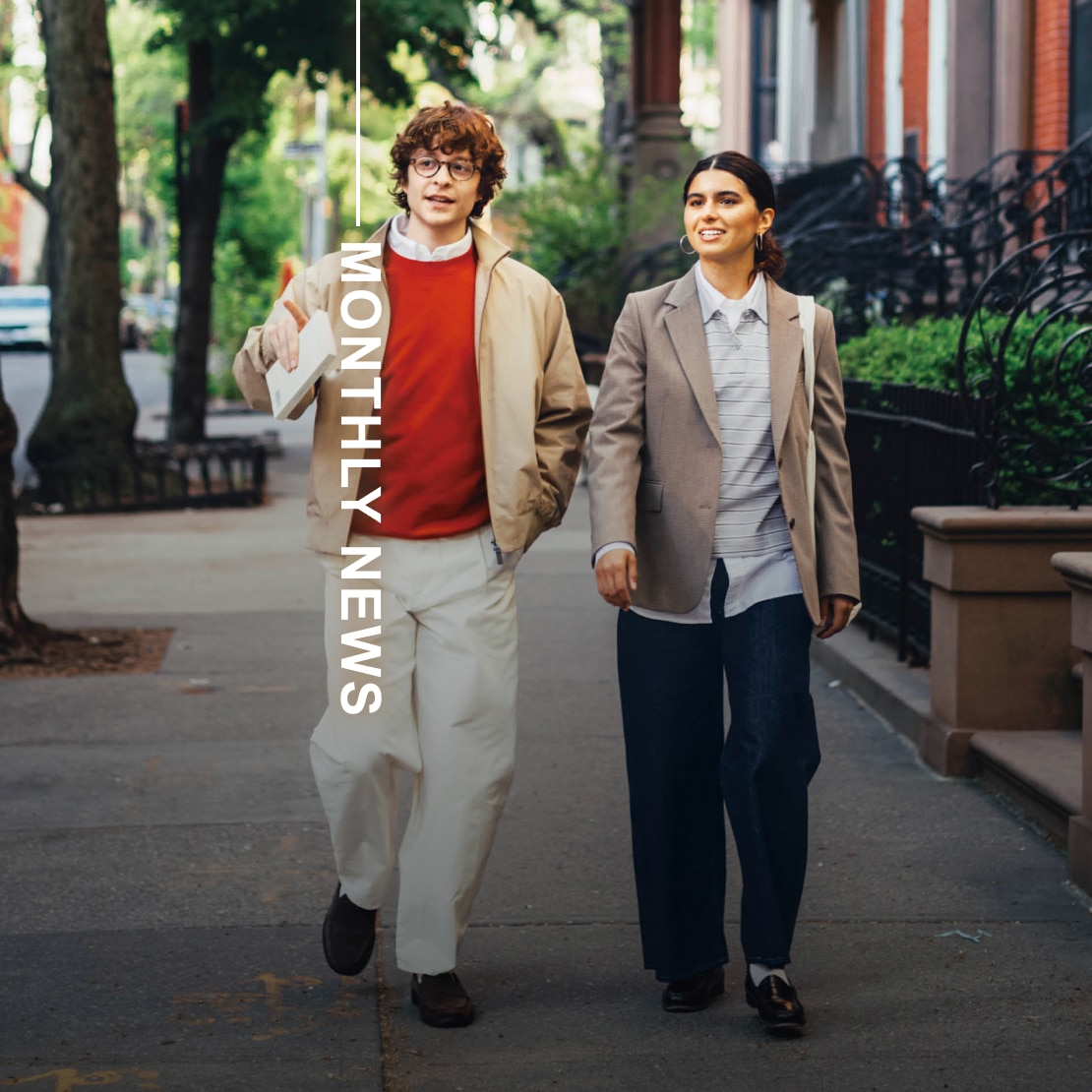 two models wearing uniqlo clothing while walking down a street in brooklyn