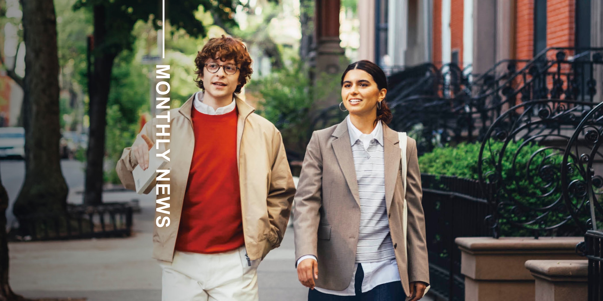 two models wearing uniqlo clothing while walking down a street in brooklyn