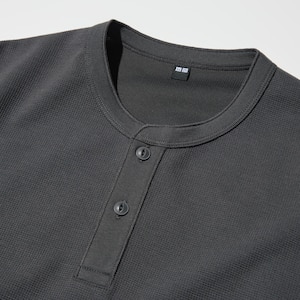 Waffle material. Henley neck looks great alone or layered.