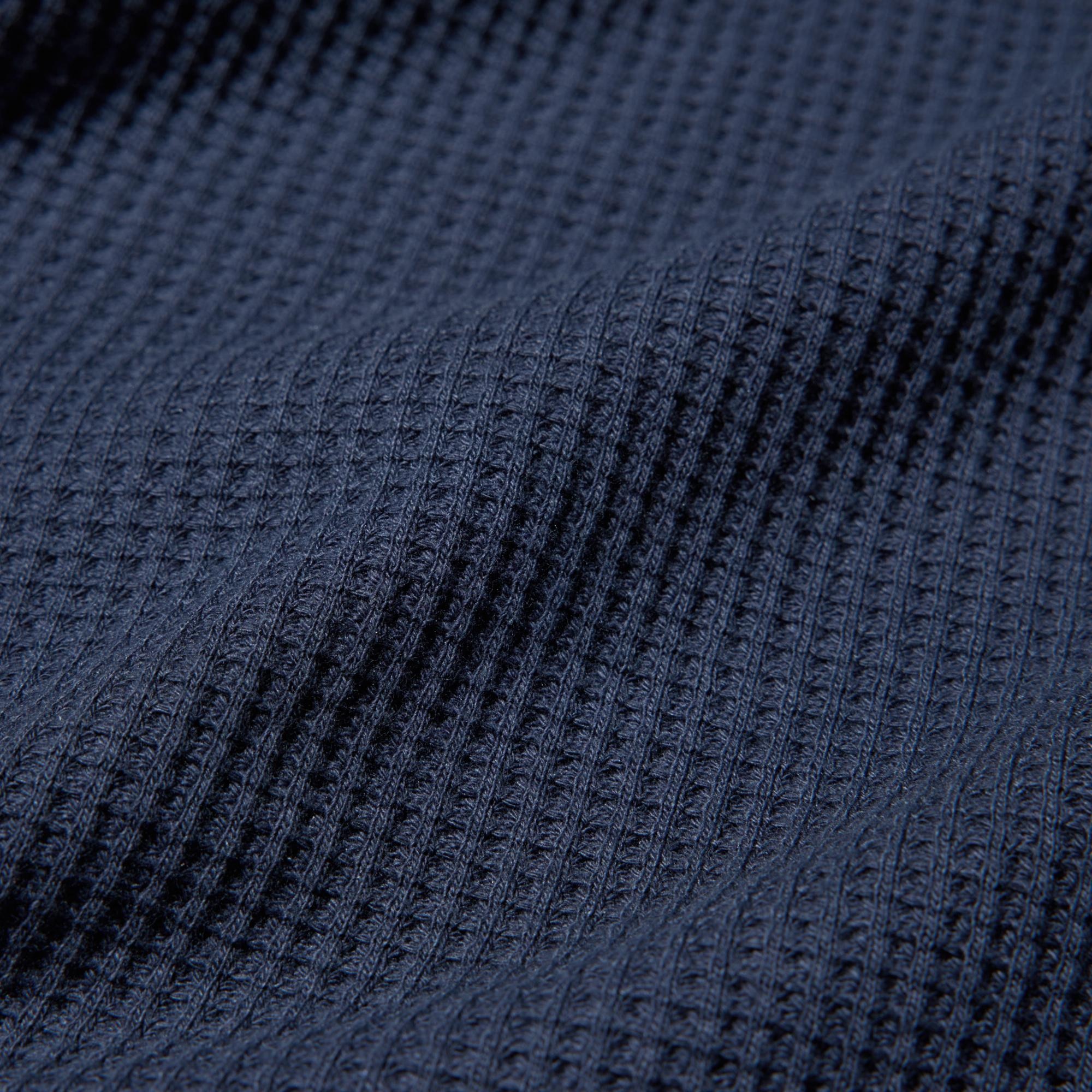 Waffle fabric, specially washed to produce a soft, puffy texture.