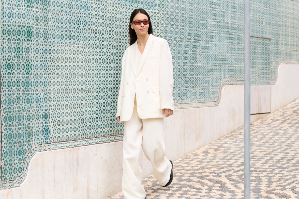 model wearing white premium linen suit by UNIQLO : C