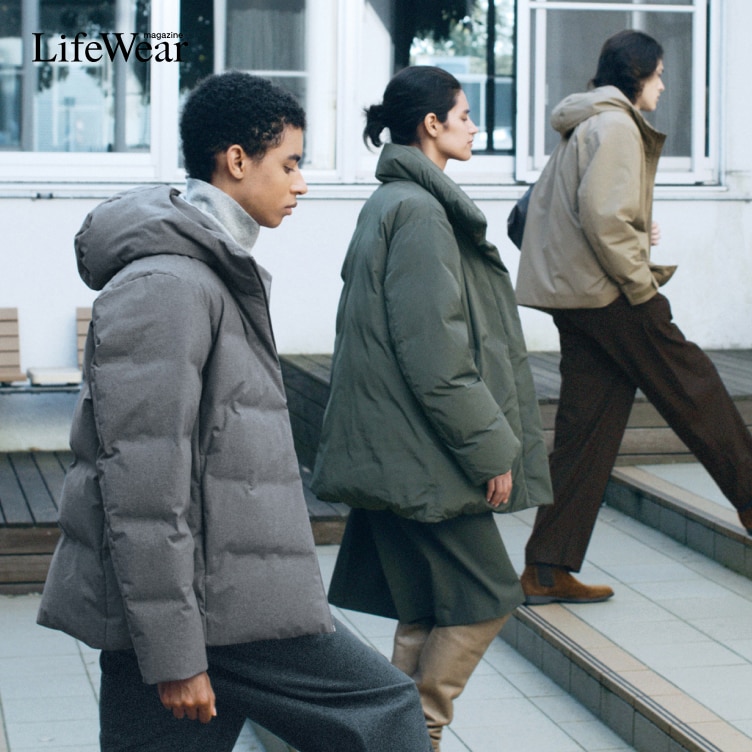 three models walking up some tiled steps outside while wearing different styles of down jacket in grey, olive and beige
