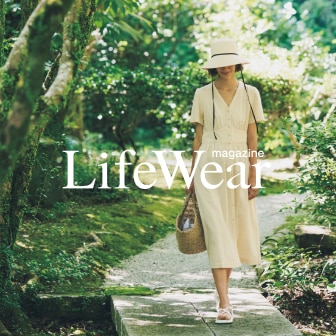 model wearing off white summer dress and hat