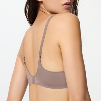 model wearing 3D hold wireless bra in brown, shown from the back
