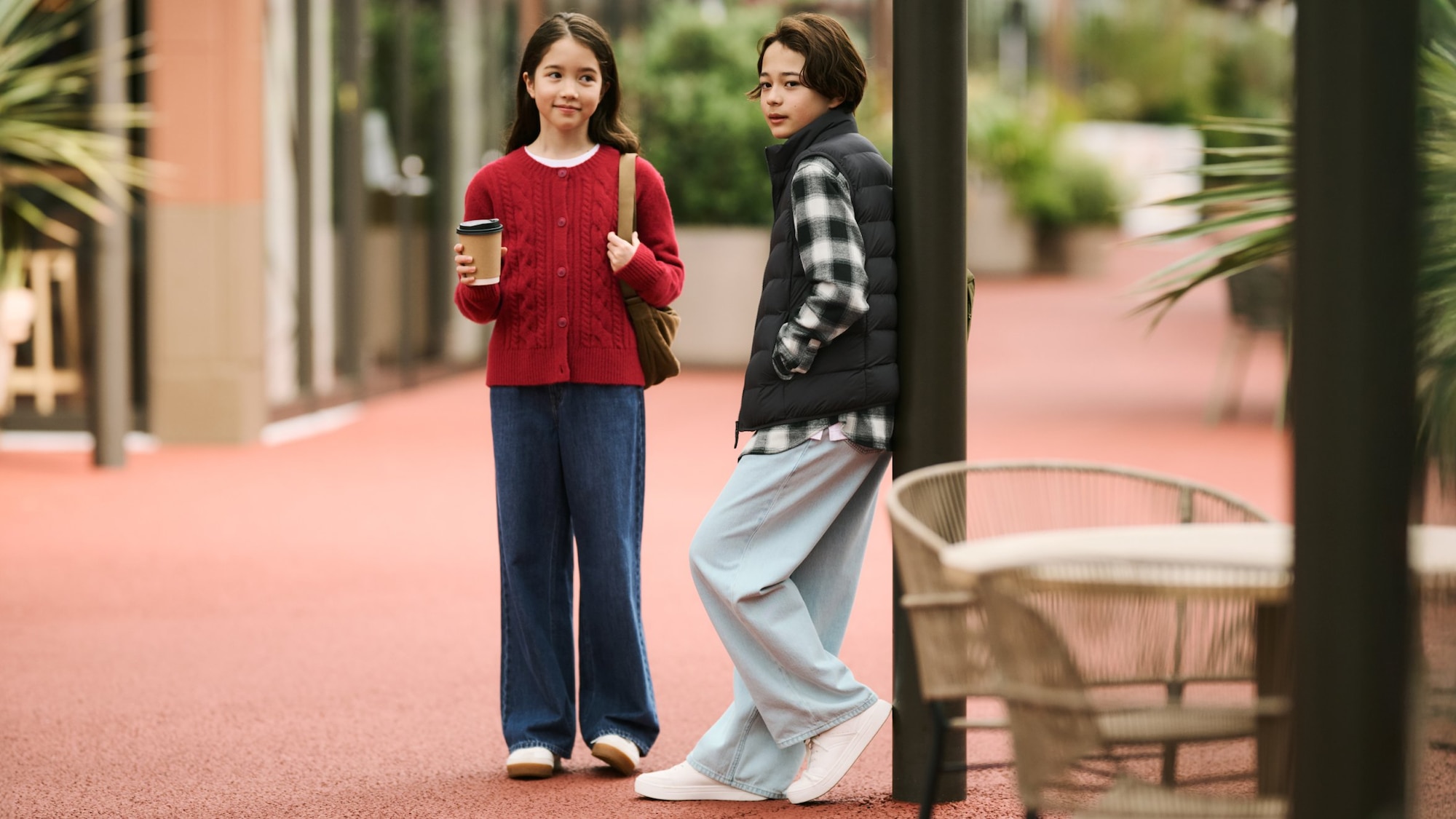 two models wearing UNIQLO Wide Straight Jeans in mid and light blue washes