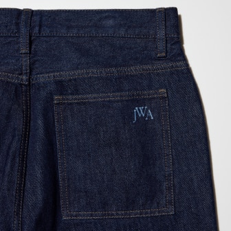 Featuring a JW ANDERSON logo on the back pocket.