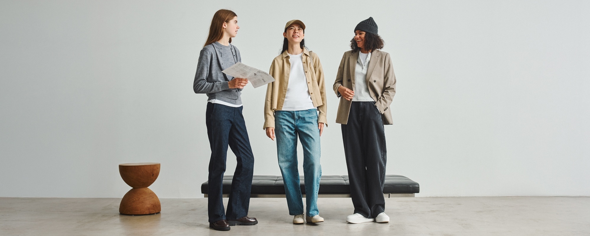 three models wearing UNIQLO jeans in blue, black and indigo washes