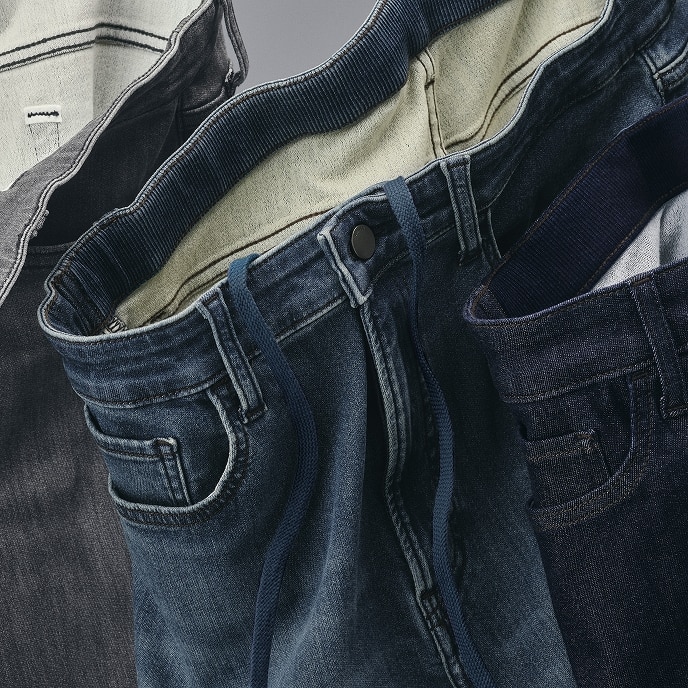 close up of the waistband of a pair of EZY Jeans in mid wash denim