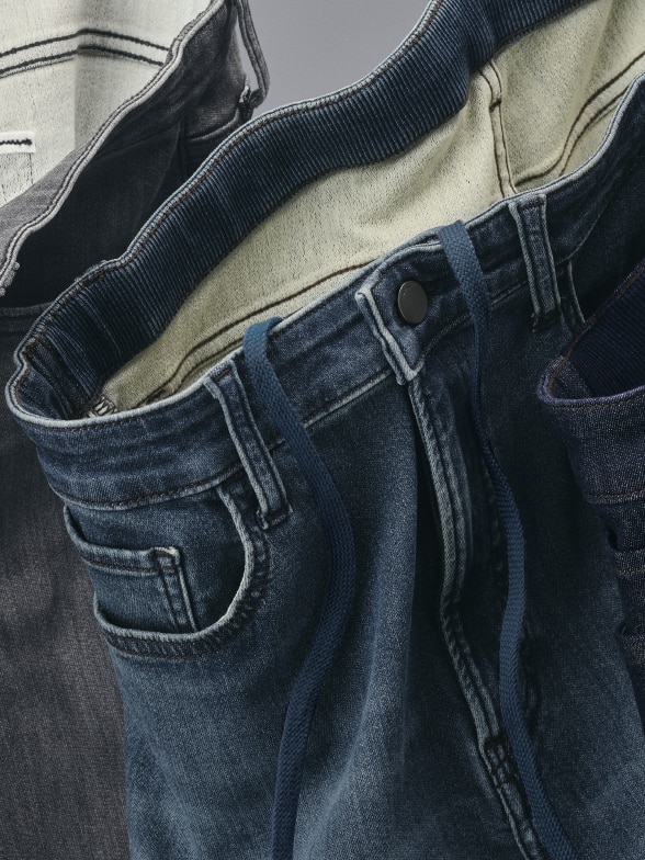 close up of the waistband of a pair of EZY Jeans in mid wash denim