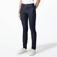 model wearing Ultra Stretch Skinny Jeans in blue with a white T-shirt