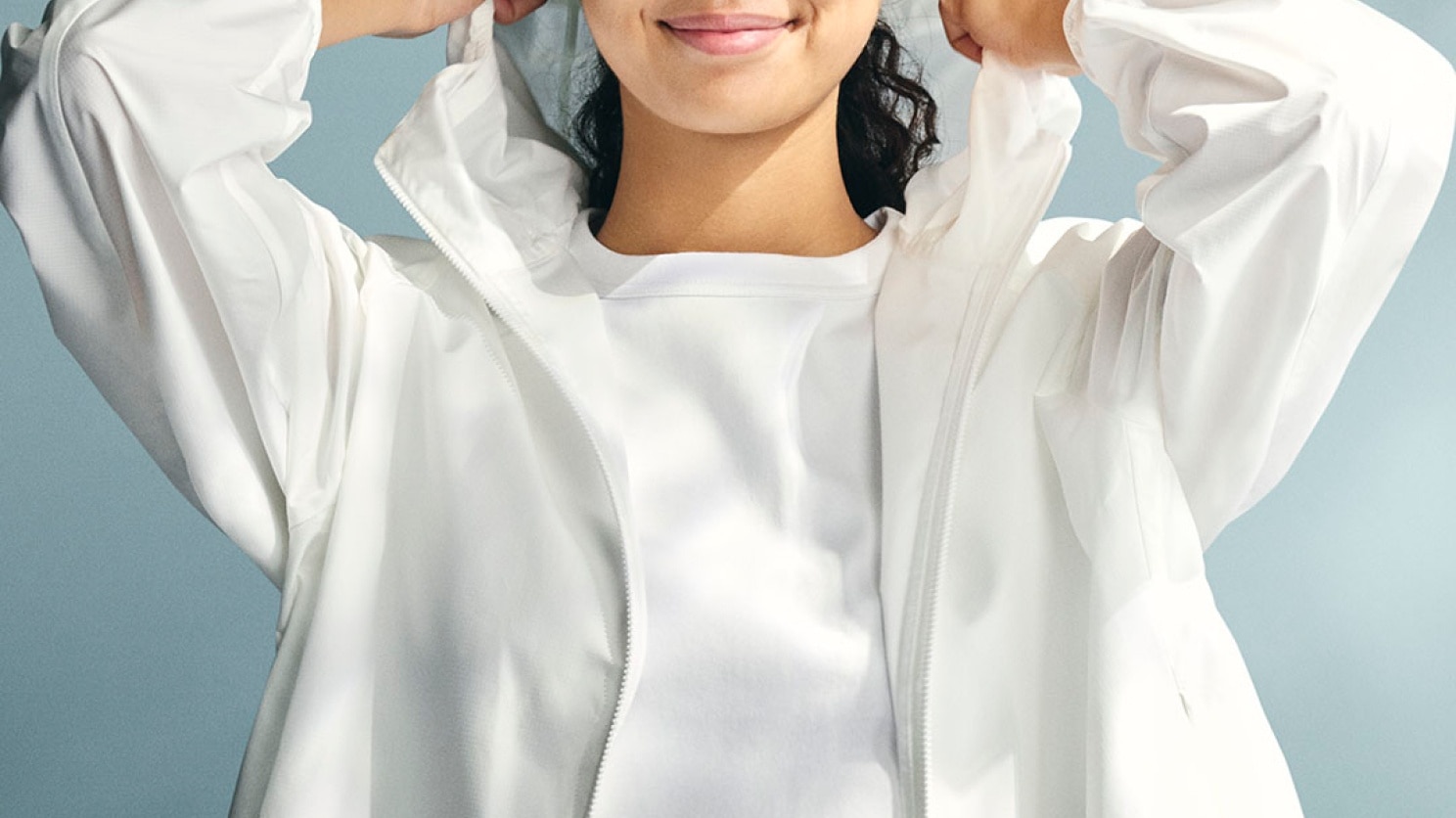 model wearing Pocketable UV Protection Parka in off white over a white T-shirt