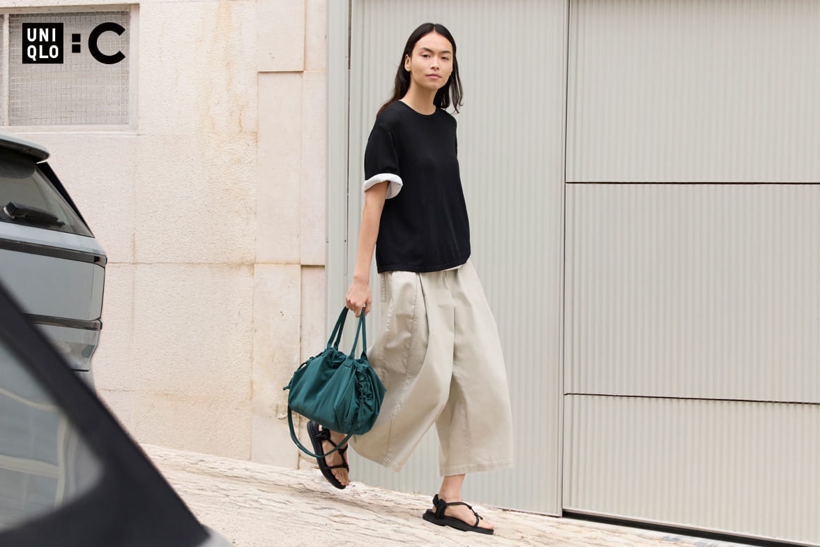 model wearing black short sleeved jumper over a white short sleeved jumper with off white culottes