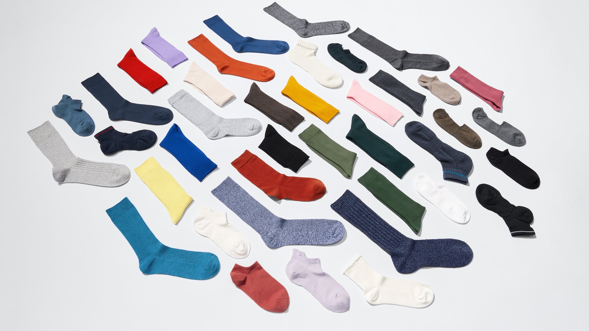 an arrangement of UNIQLO socks in different styles and colours