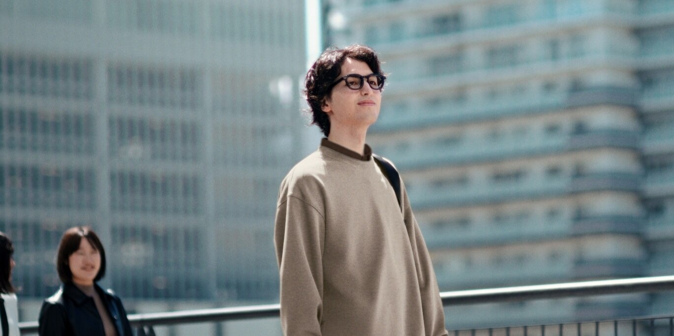 models wearing UNIQLO sweatshirts and hoodies while posing for photos