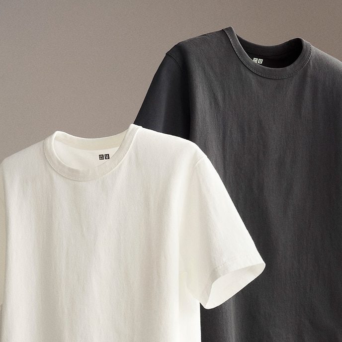 Crew Neck T-Shirt in white and dark grey, suspended against a grey background