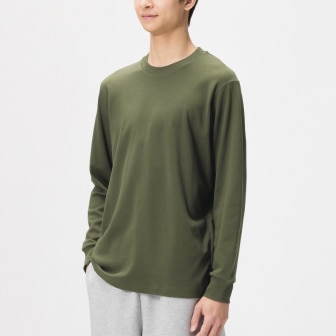 model wearing Soft Brushed Crew Neck T-Shirt in olive with off white trousers
