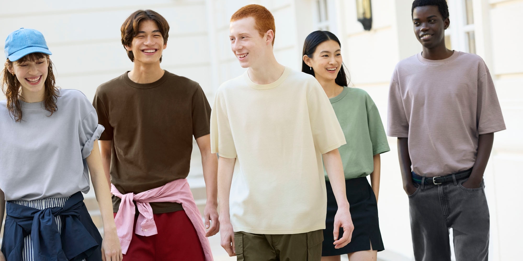 group of models wearing UNIQLO T-shirts outside in the sunshine