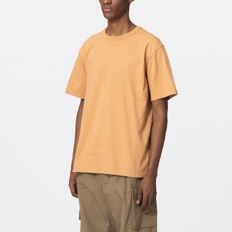 model wearing Crew Neck T-Shirt in light orange
