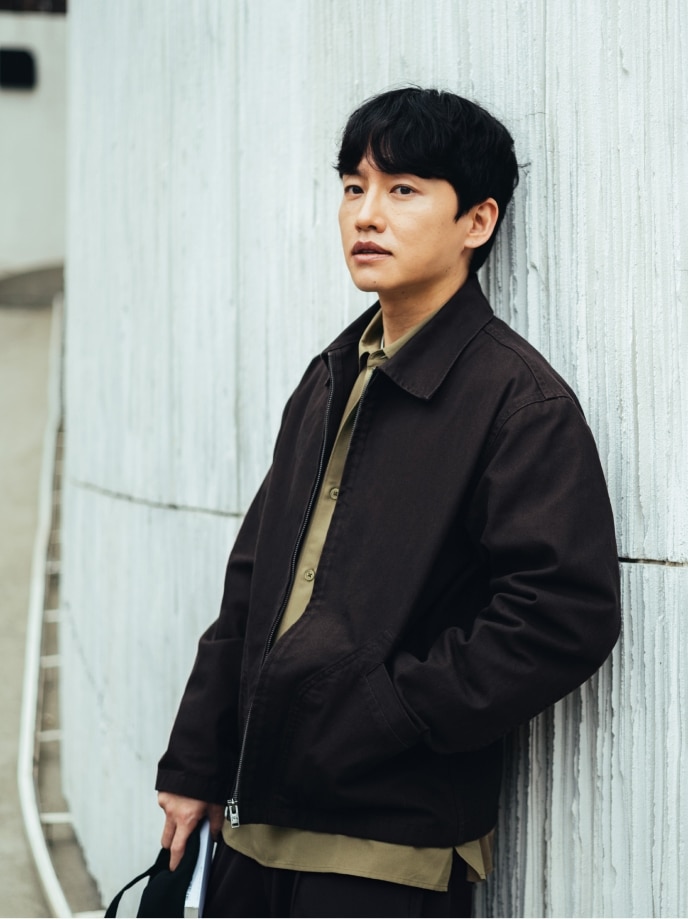 Wie Sung Woong wearing Zip-Up Blouson, Easy Care Soft Shirt and Pleated Relaxed Wide Trousers