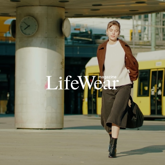 actor Greta Krämer wearing Zip-Up Short Jacket, Soufflé Yarn Crew Neck Jumper, Soft Ribbed T-Shirt, Denim Culottes and carrying Soft Coated Drawstring Bag