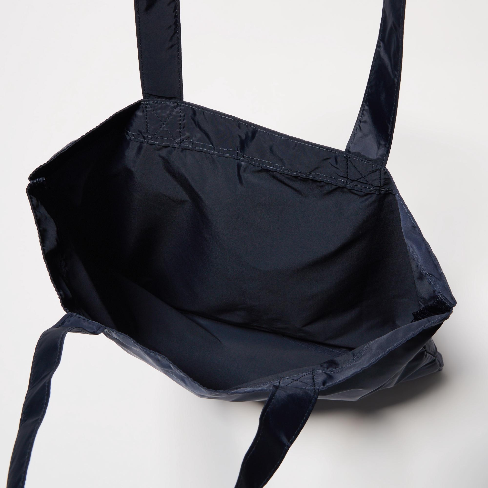 【Anya Hindmarch】UNIQLO ユニクロ 折り畳み eyes バッグ 黒 Anya Hindmarch】UNIQLO ユニクロ 折り畳み eyes バッグ 黒