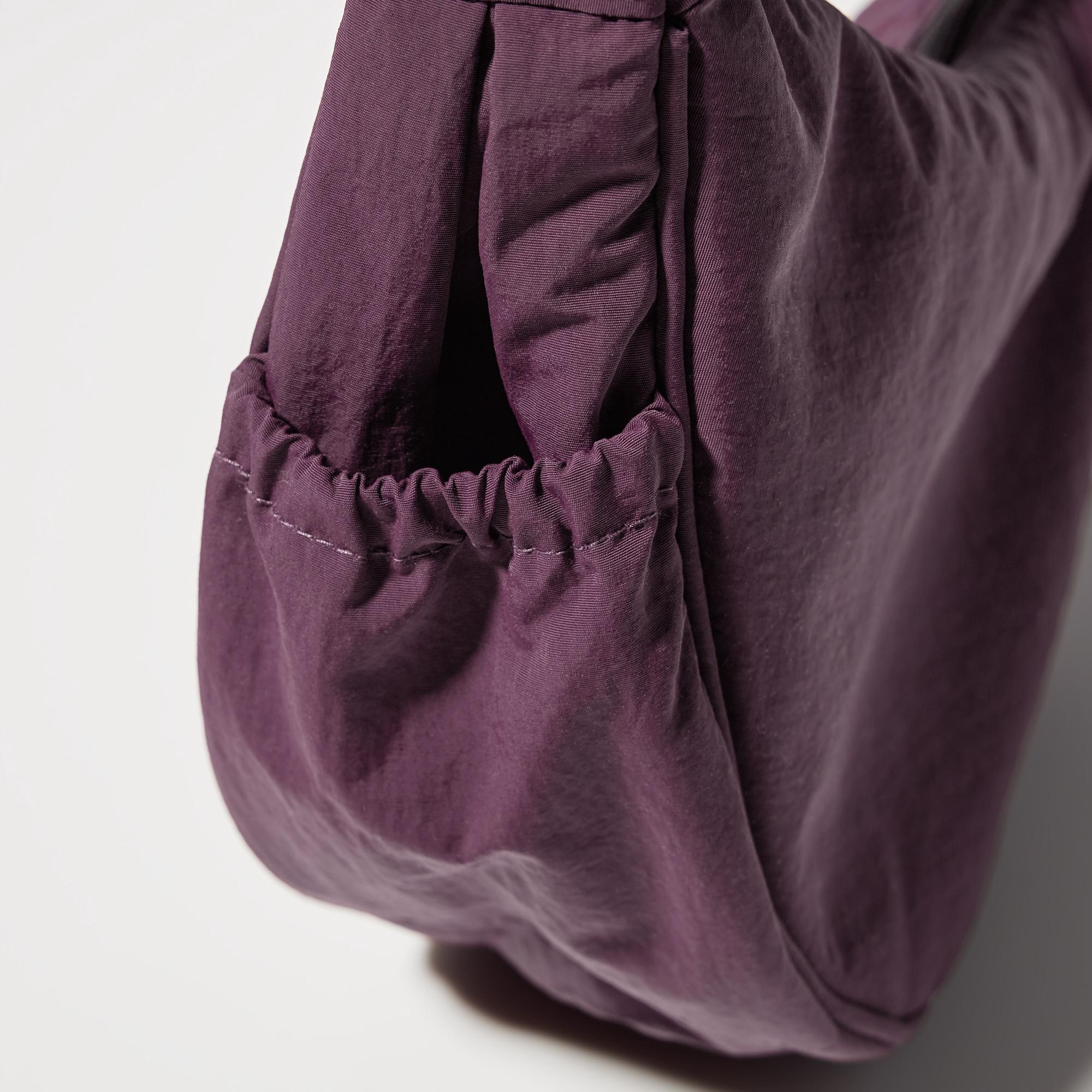 Extra strap length can be stored in the side pocket.