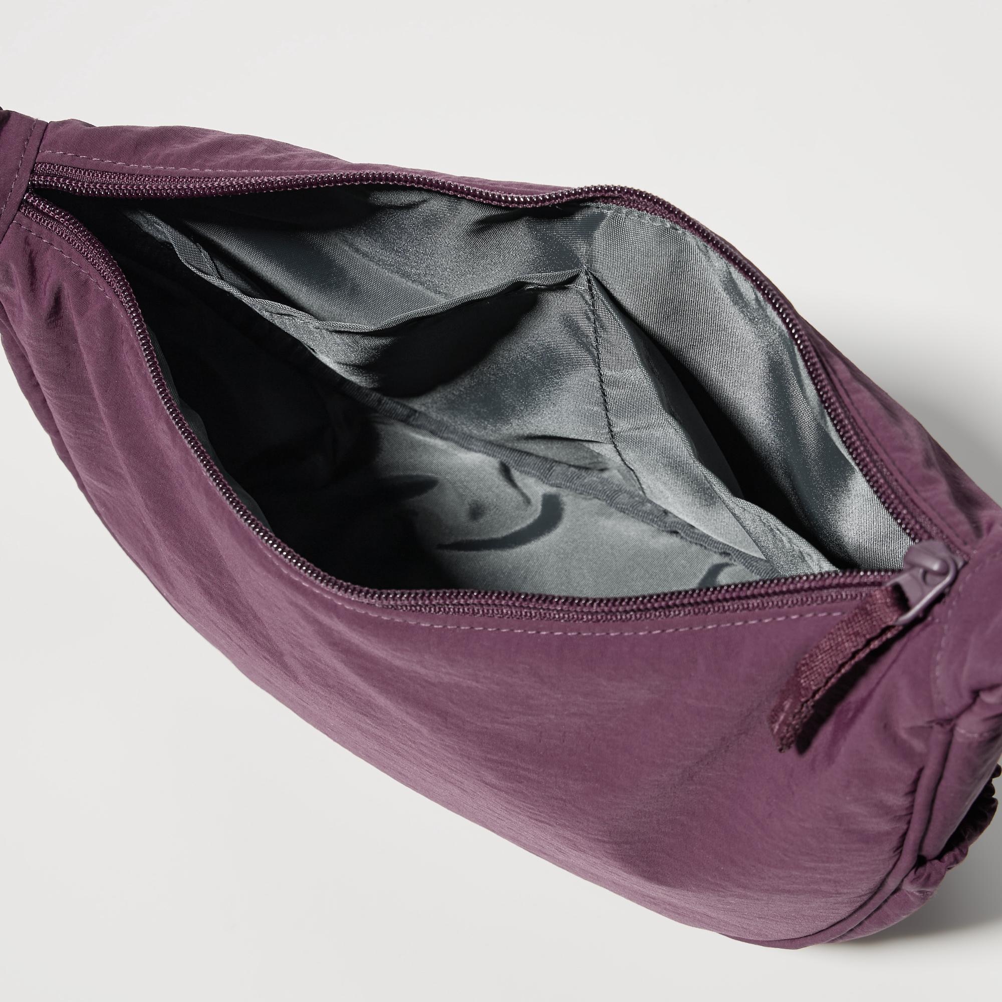 Featuring interior pockets and a gusset design with side tucks.
