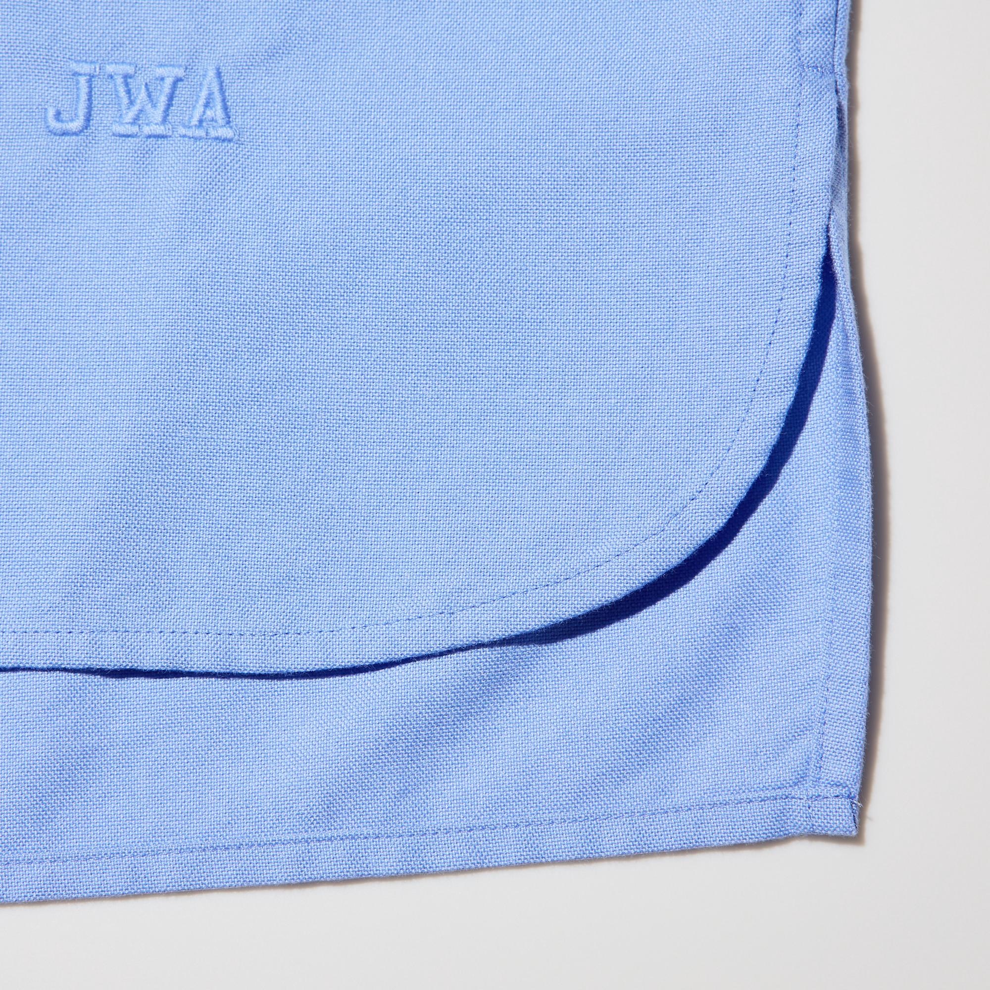 Rounded front hem and straight back hem. Distinctive asymmetric hem design.