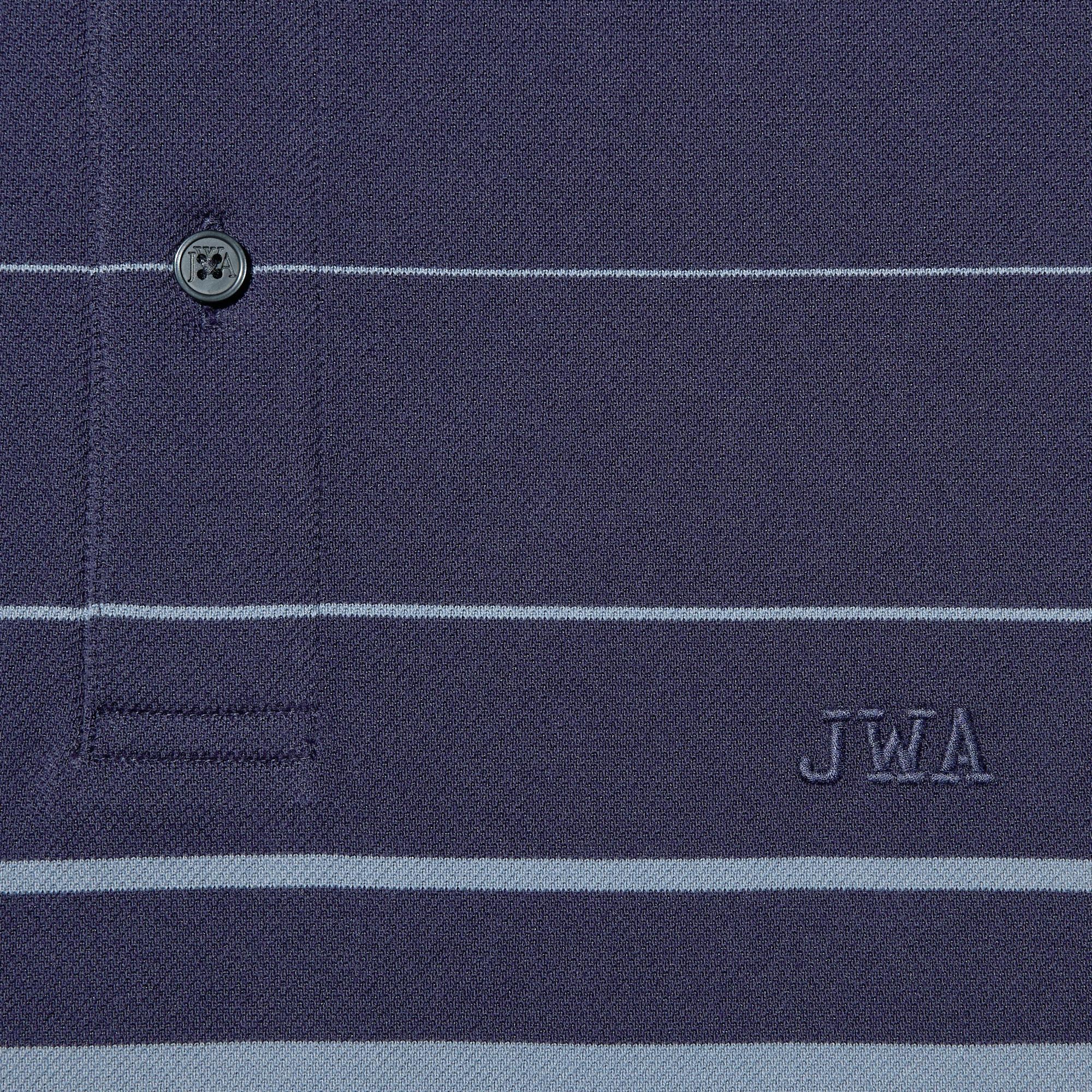 Embroidery on the chest adds a design accent. JW ANDERSON logo buttons.