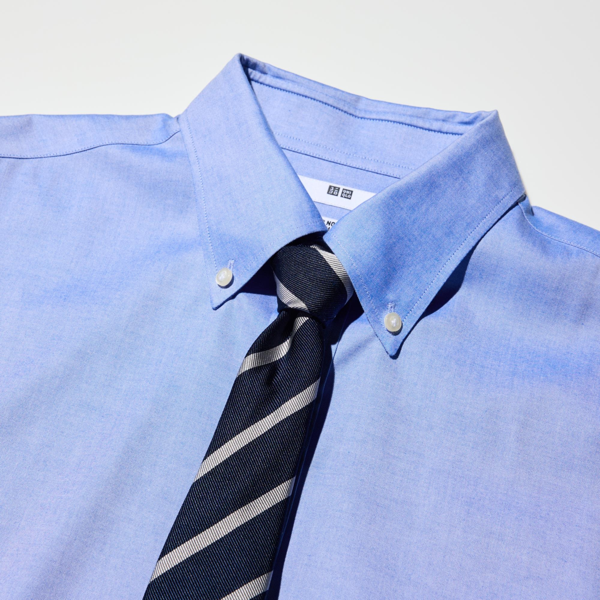 The collar band height and collar shape are designed to look good with a necktie.