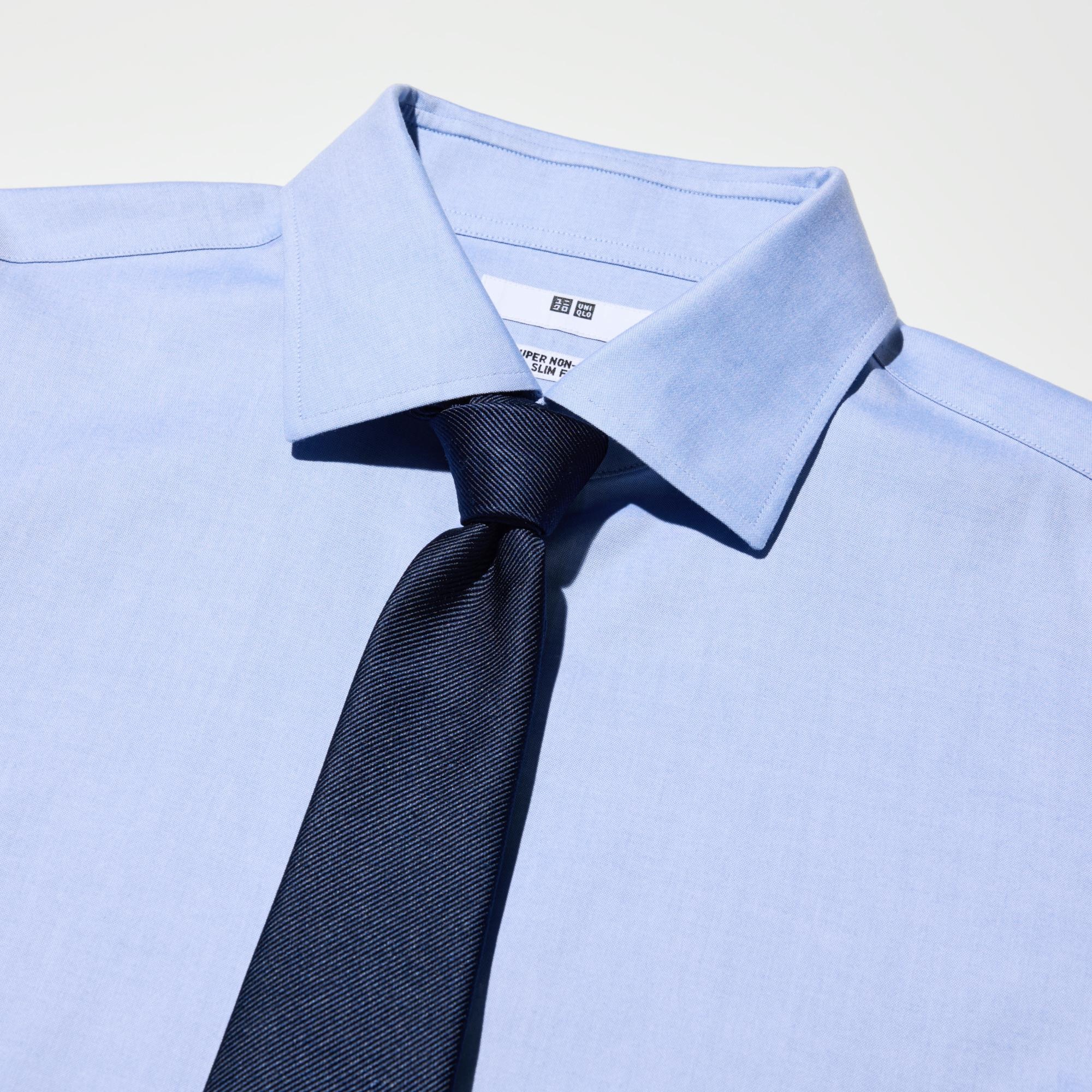 The collar band height and collar shape are designed to look good with a necktie.