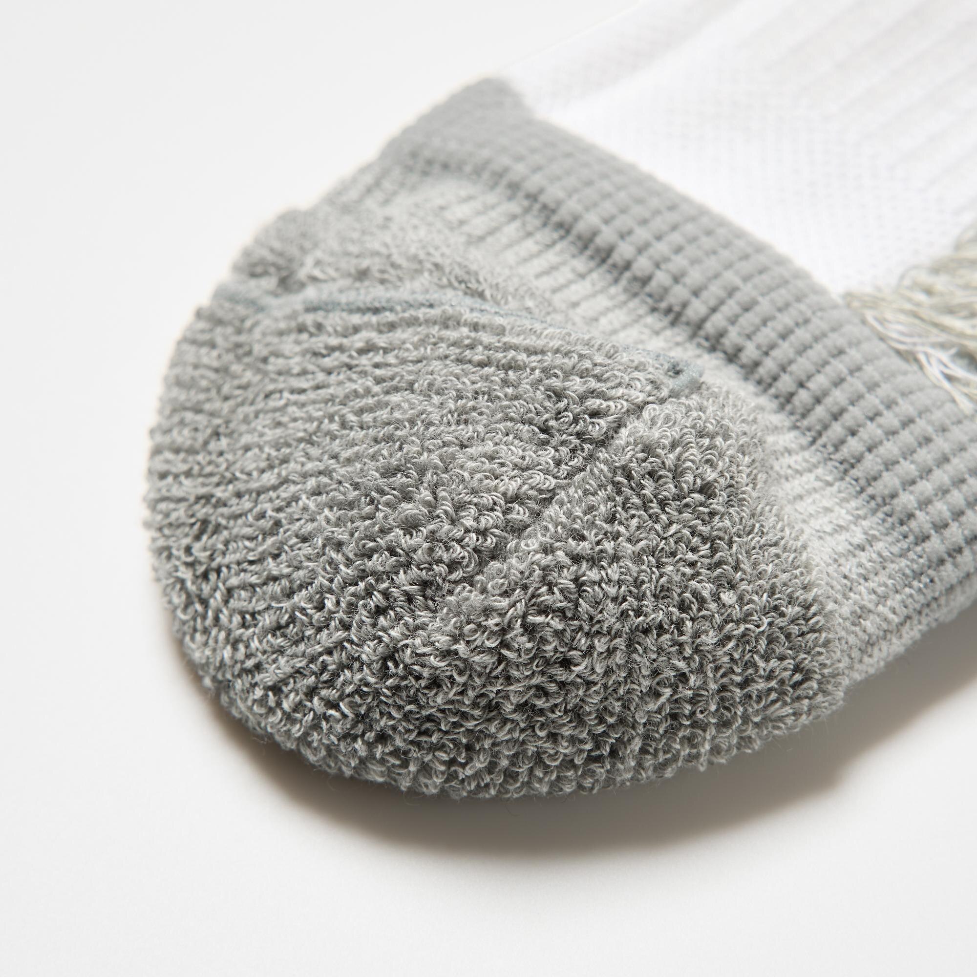 Cushioned pile weave at the toe and heel reduces impact. Reinforced toes and heels to prevent holes.