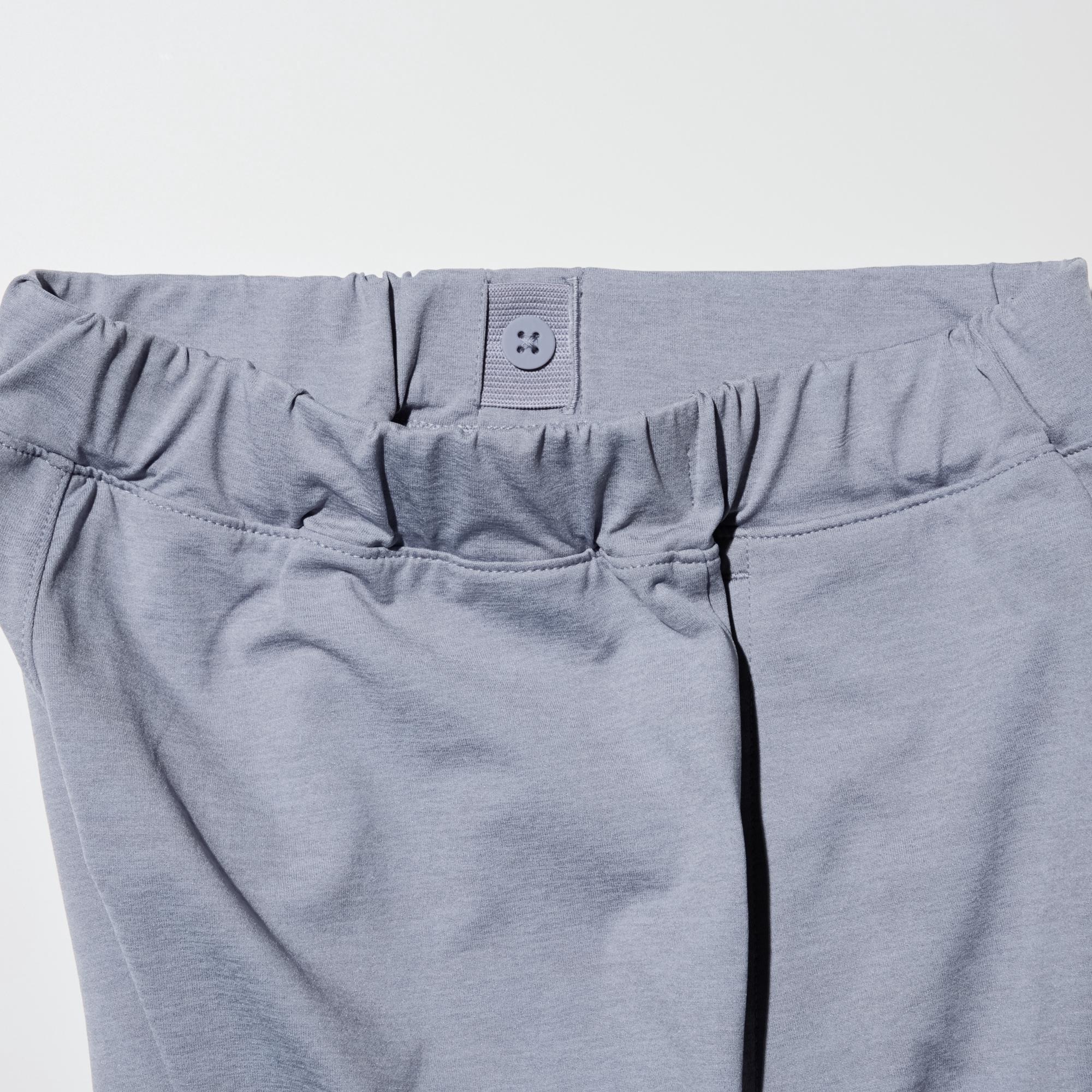 To adjust the fit, pull the elastic waistband through the opening and button at the desired location.
