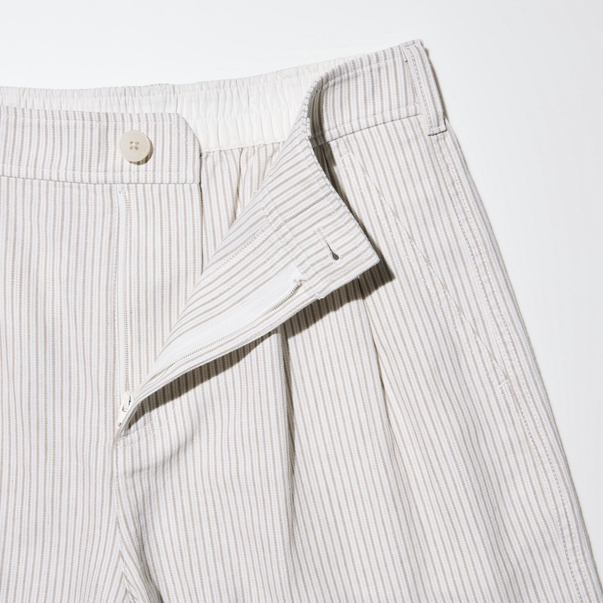 High-waist with a front slide fastener. Elastic waistband for comfort and easy dressing.