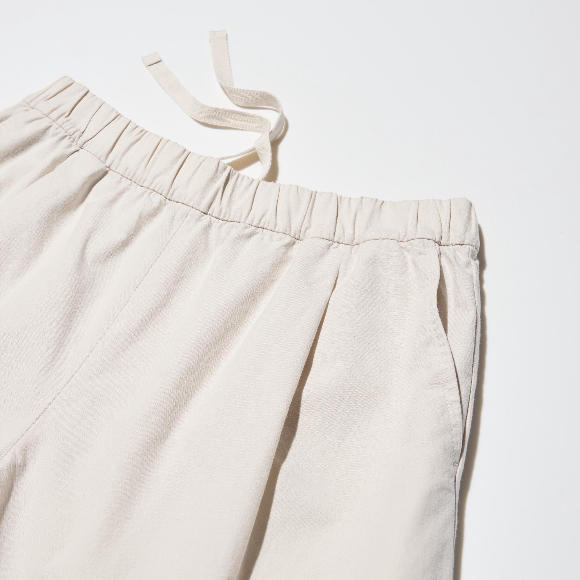 Comfortable elastic waist. Tucks at the front.