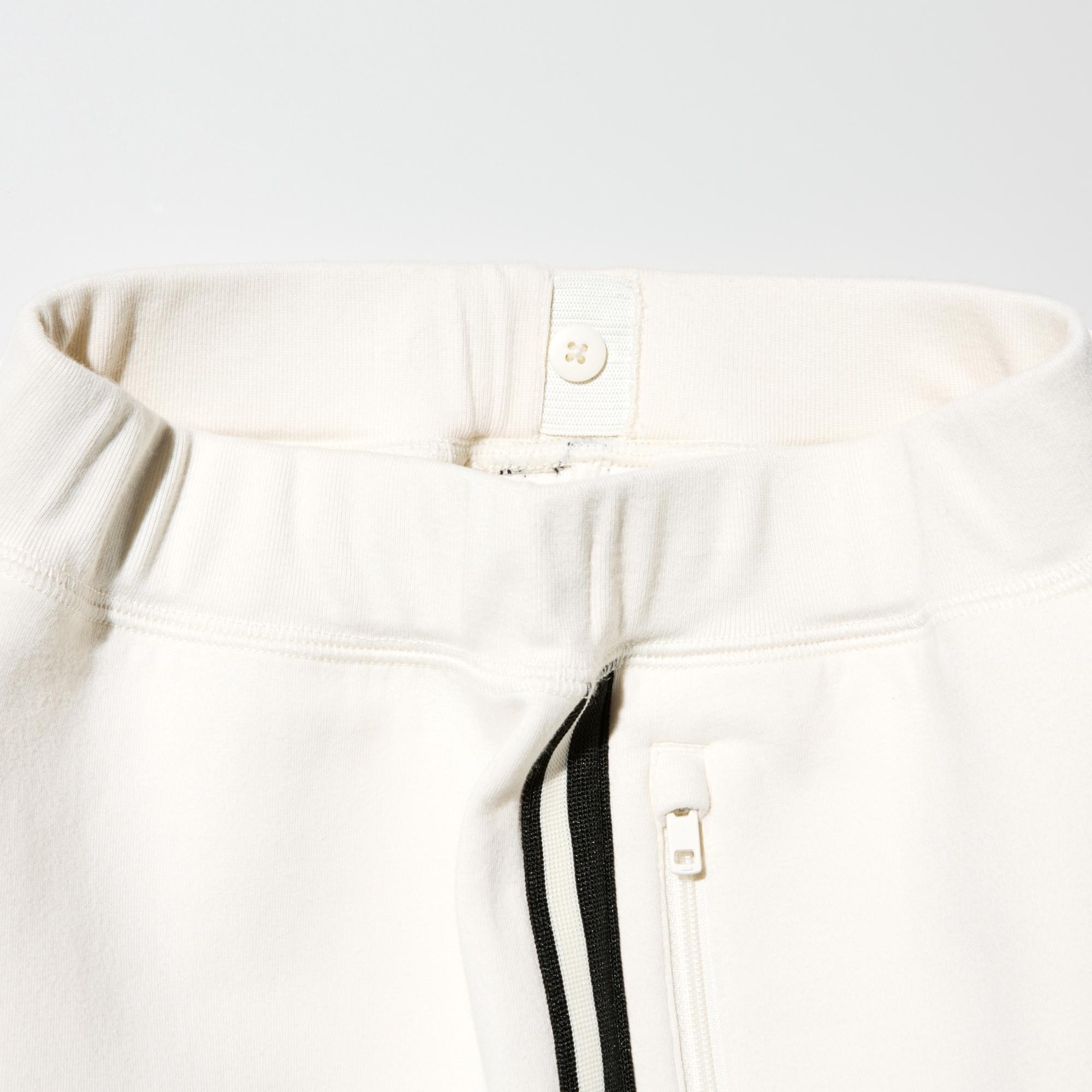 To adjust the fit, pull the elastic waistband through the opening and button at the desired location.