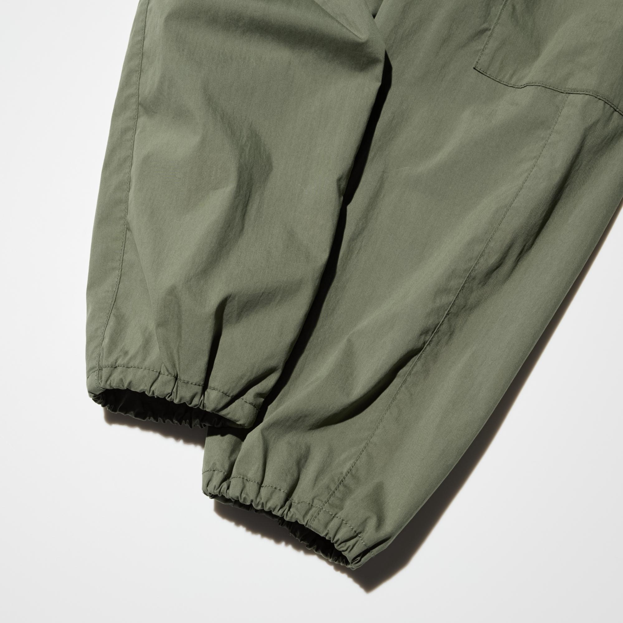 Wide silhouette with jogger-style hems for easy movement.