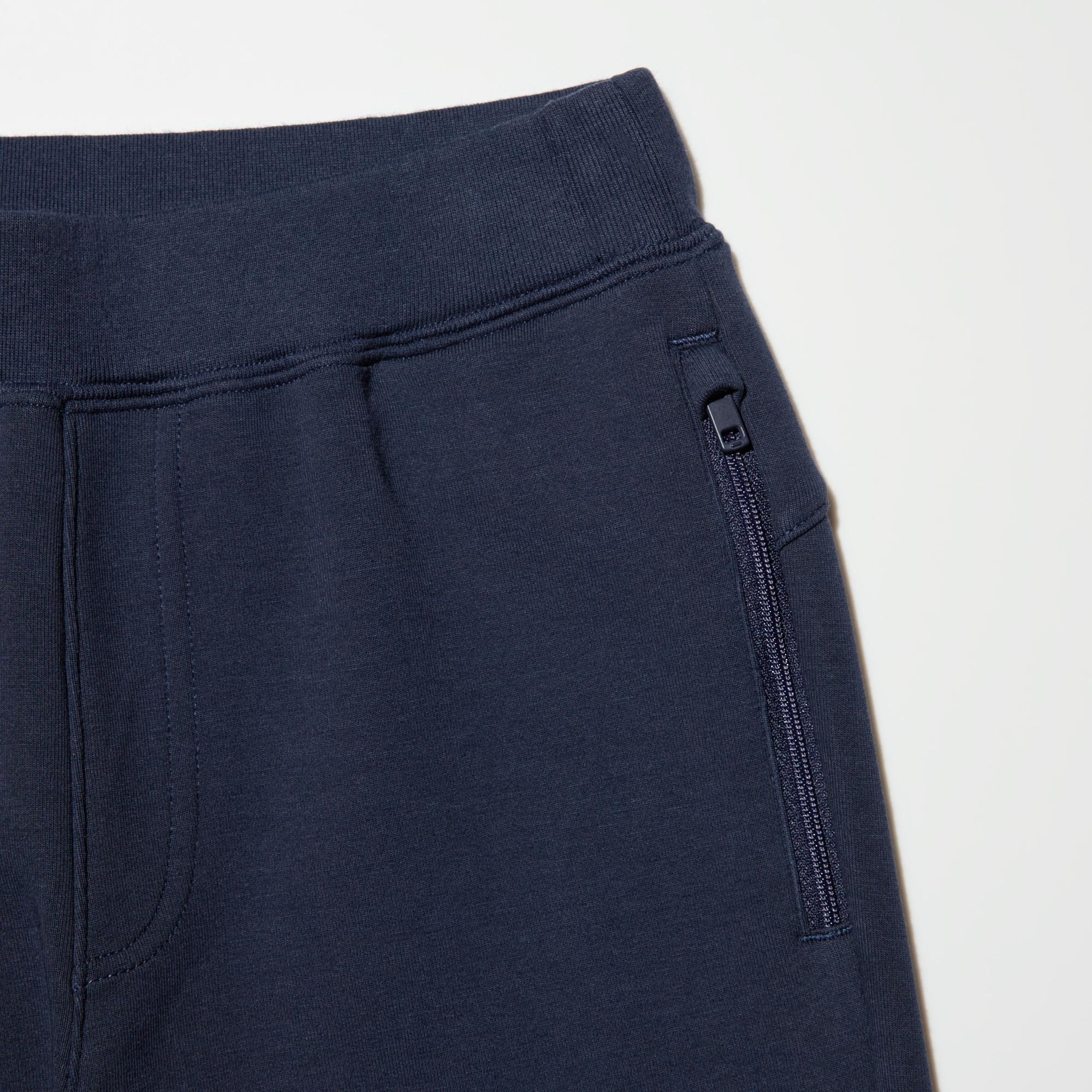 Pockets with slide fasteners keep belongings safe.