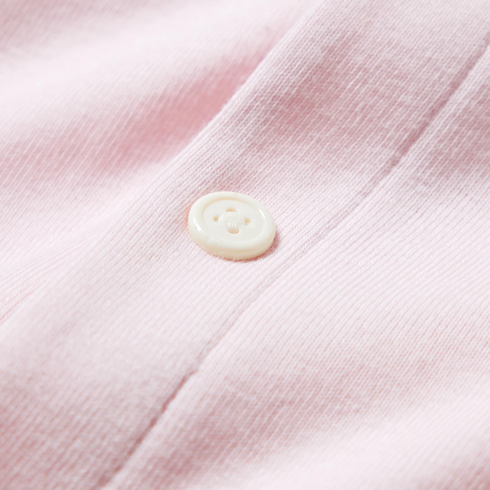 Large button-like snap-fasteners add a style accent and are easy to fasten.