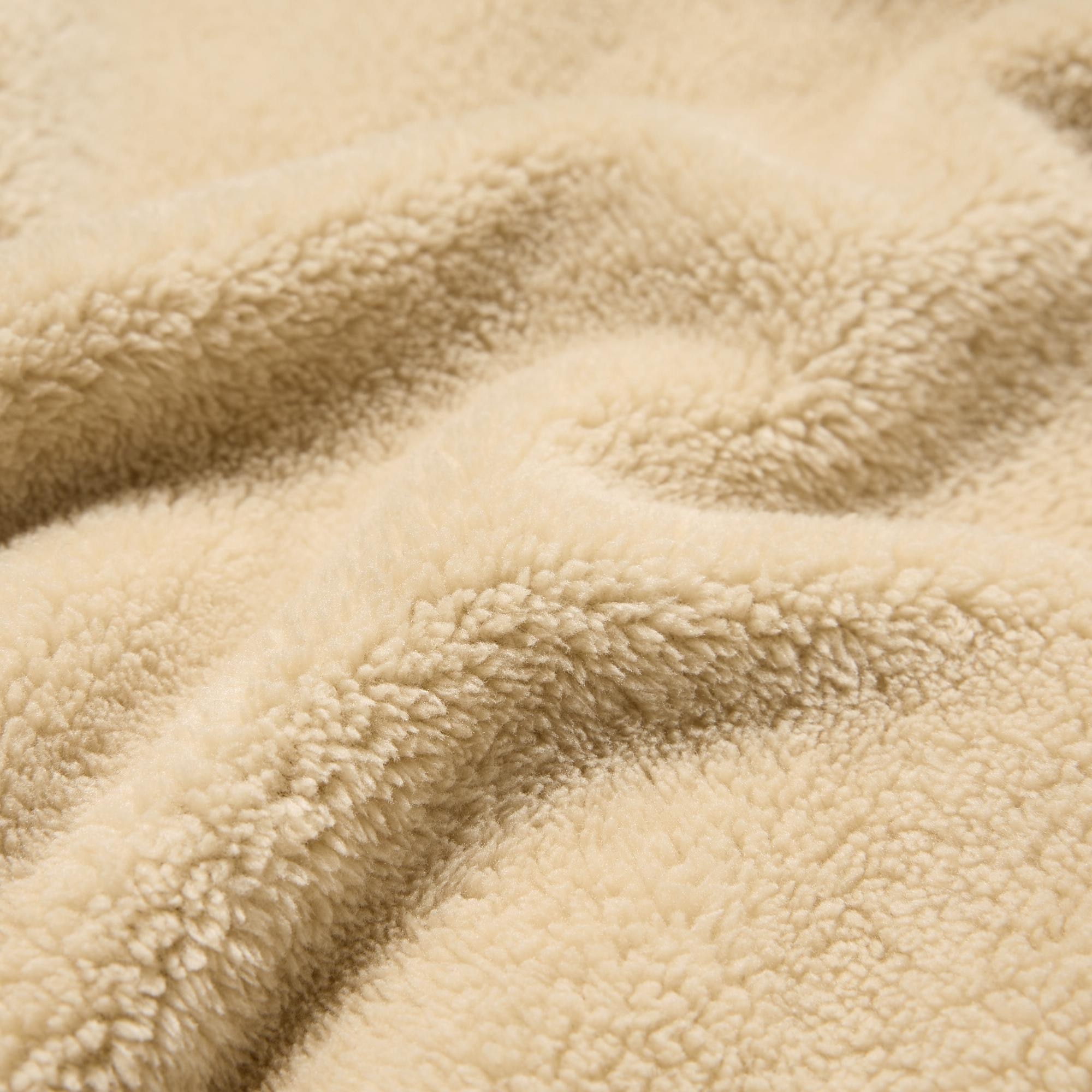 Lightweight, fluffy yarn fabric with a warm and cozy feel.