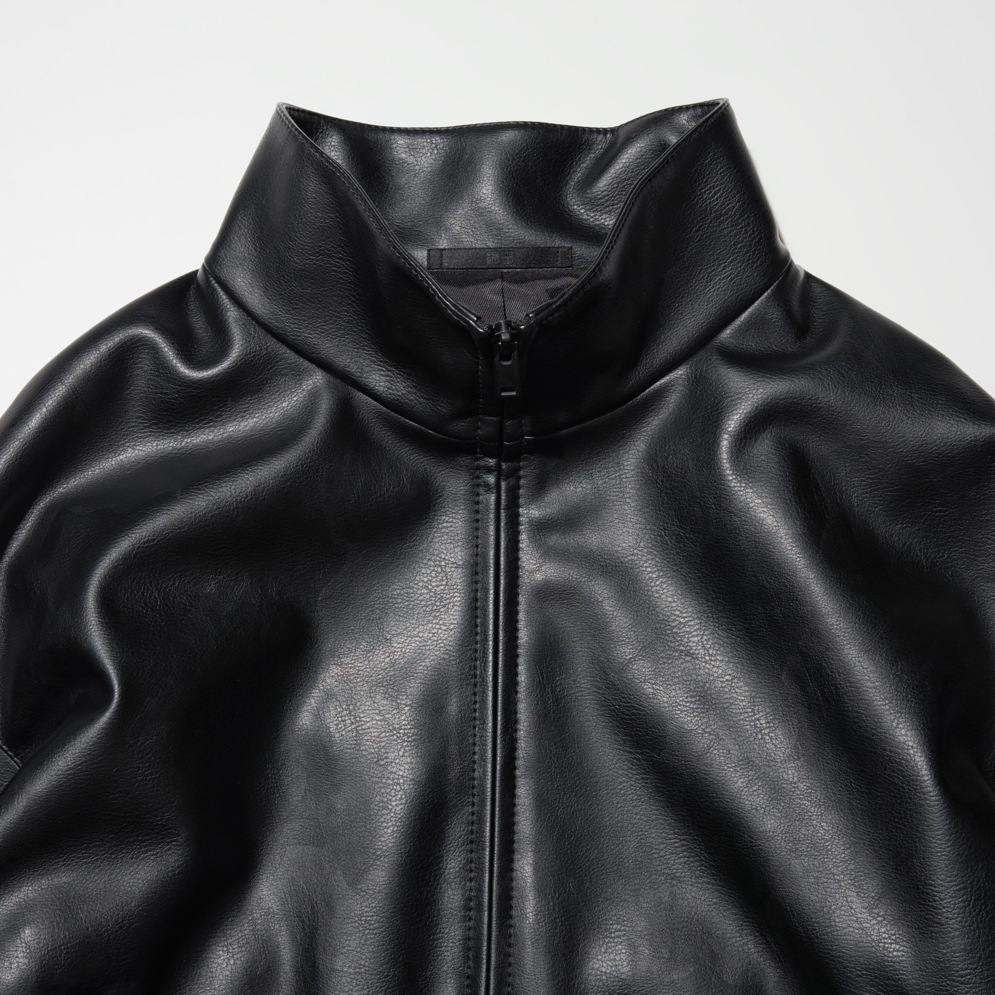 Oversized blouson with fastener and stand collar.
