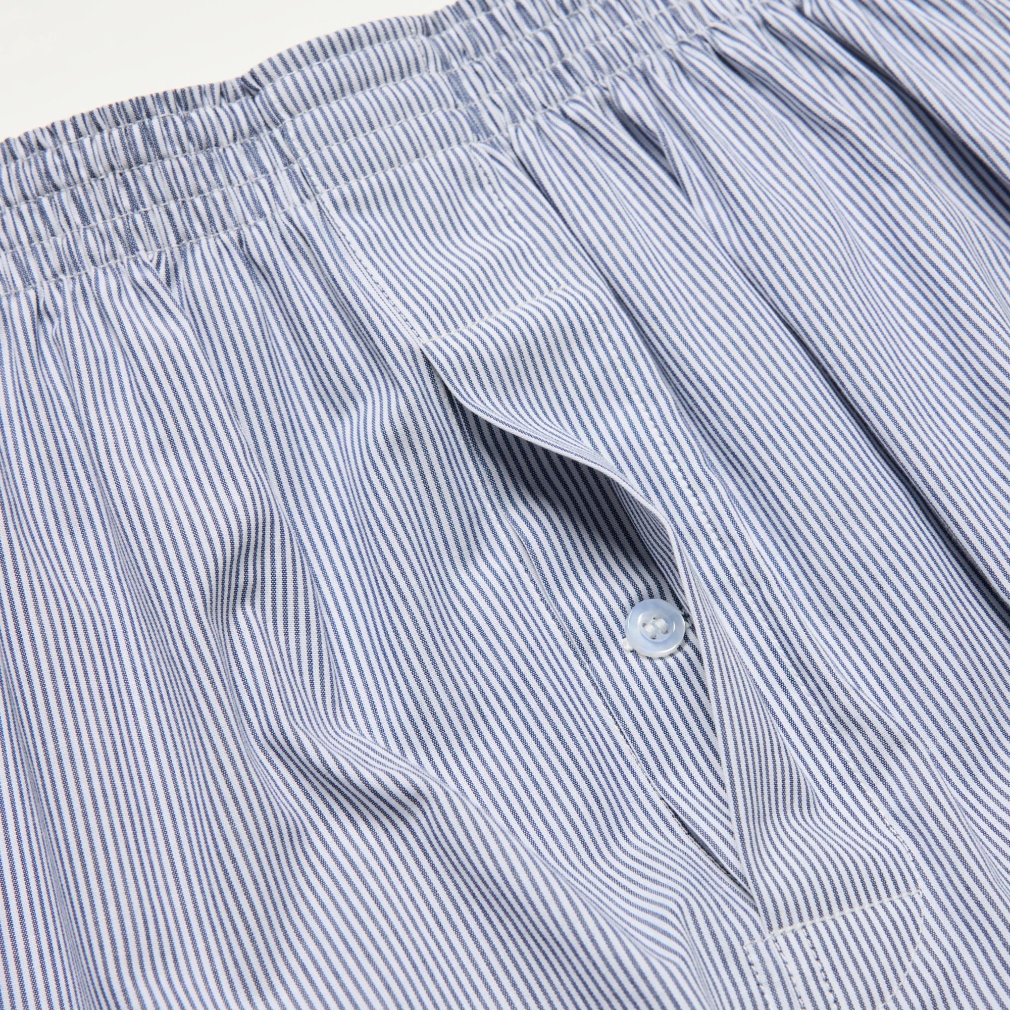Sleek button-up fly front design. Side slits for easy movement.