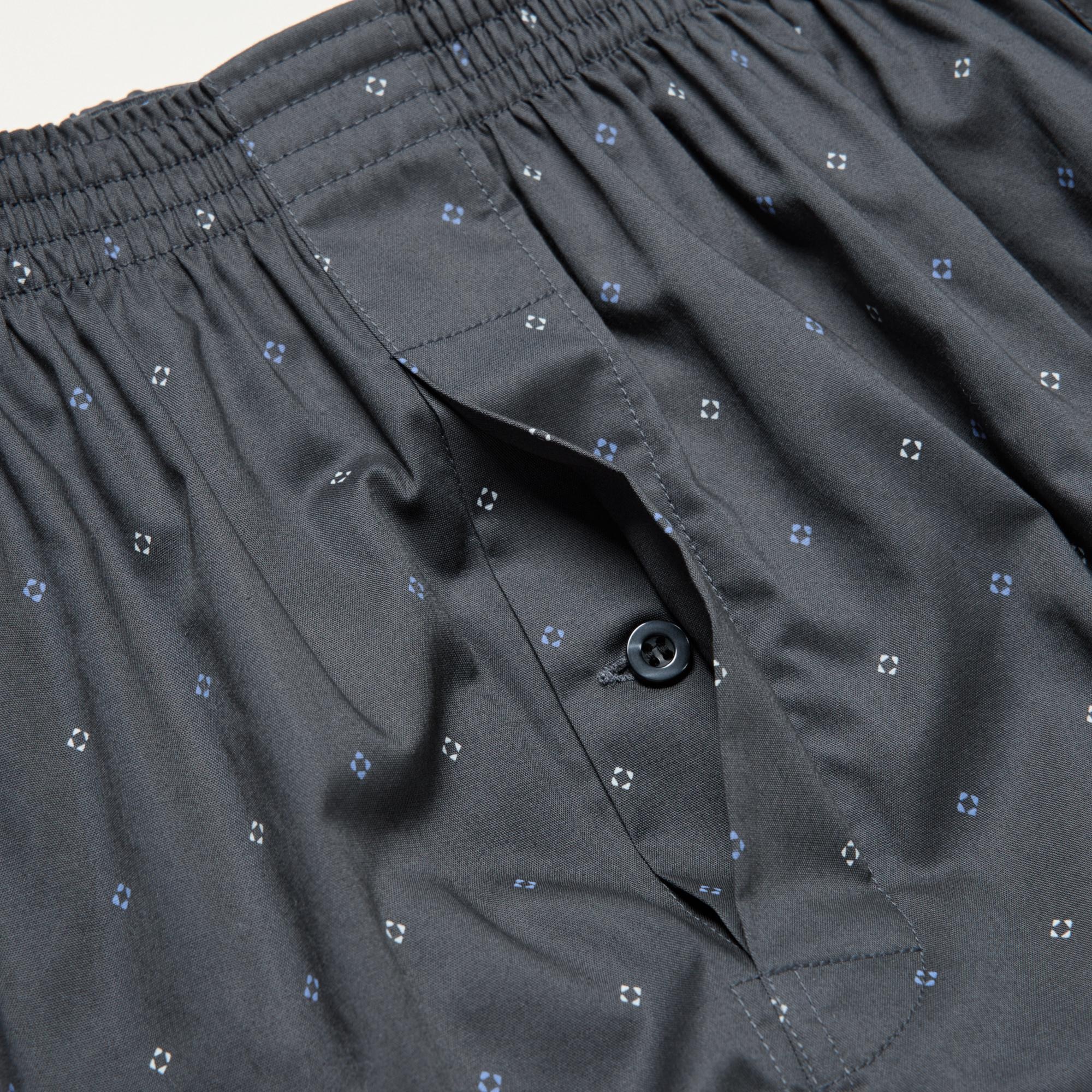 Sleek button-up fly front design. Side slits for easy movement.
