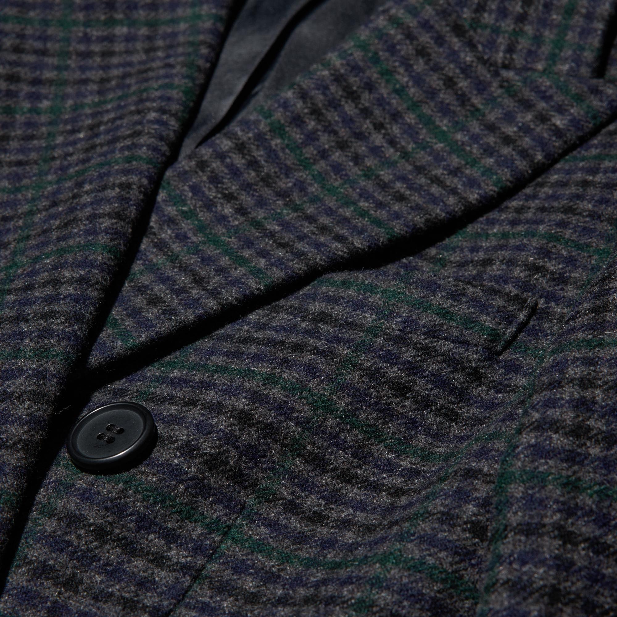 Double breasted design and fabric with a tailored look.
