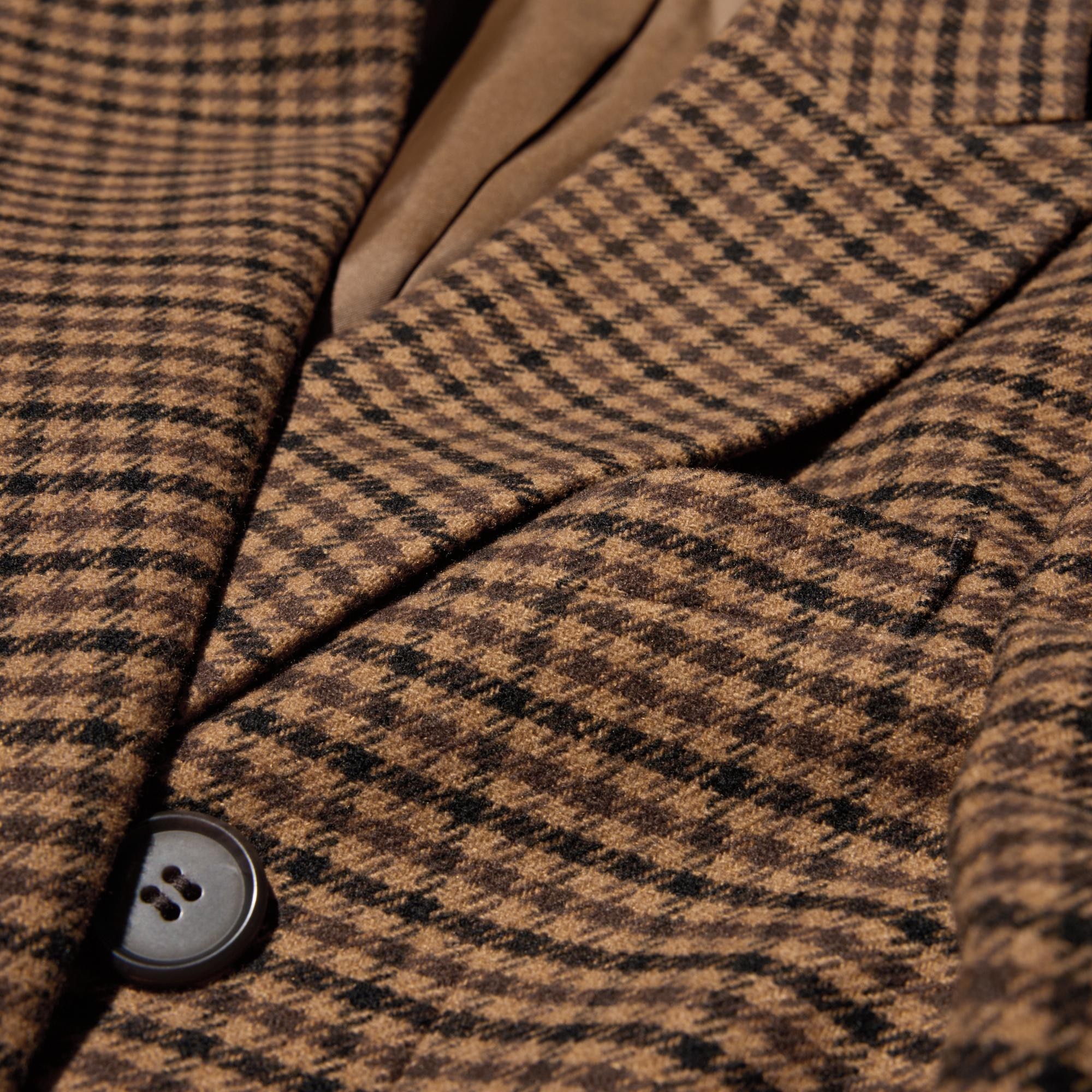 Double breasted design and fabric with a tailored look.